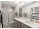 Bathroom boasts double vanity, large shower, and elegant tile at 4197 Spring Valley Cir, Tucker, GA 30084