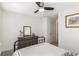 Bedroom with dresser, metal bed frame, and access to hallway at 4197 Spring Valley Cir, Tucker, GA 30084