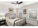 Bright bedroom with metal bed frame and window blinds at 4197 Spring Valley Cir, Tucker, GA 30084