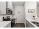 Modern kitchen with stainless steel appliances and white cabinets at 4197 Spring Valley Cir, Tucker, GA 30084