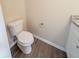 Clean bathroom with granite countertop, white cabinets, and vinyl flooring at 444 Kara Ln, Mcdonough, GA 30253