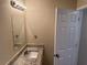 Bathroom with granite countertop, single sink, and a mirror at 444 Kara Ln, Mcdonough, GA 30253