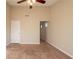 Large bedroom with ceiling fan and access to hallway at 444 Kara Ln, Mcdonough, GA 30253