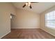 Bright bedroom with vaulted ceiling and large window at 444 Kara Ln, Mcdonough, GA 30253