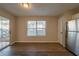 Bright dining area with wood-look flooring and sliding glass door at 444 Kara Ln, Mcdonough, GA 30253