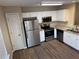 Stainless steel appliances and granite countertops in this eat-in kitchen at 444 Kara Ln, Mcdonough, GA 30253