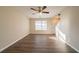 Spacious living room with large window and ceiling fan at 444 Kara Ln, Mcdonough, GA 30253