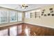 Finished basement with hardwood floors and built-in shelving at 6733 Holiday Pt, Buford, GA 30518