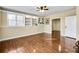 Bright basement rec room with hardwood floors and built-in shelving at 6733 Holiday Pt, Buford, GA 30518