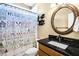 Lake-themed bathroom with a black granite vanity at 6733 Holiday Pt, Buford, GA 30518