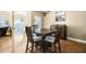 Spacious dining area with hardwood floors and a view to the kitchen at 6733 Holiday Pt, Buford, GA 30518