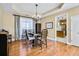 Bright dining room with hardwood floors and a chandelier at 6733 Holiday Pt, Buford, GA 30518