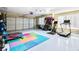 Spacious garage gym, featuring flooring and various exercise equipment at 6733 Holiday Pt, Buford, GA 30518