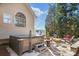 Hot tub area with stone patio and seating at 6733 Holiday Pt, Buford, GA 30518