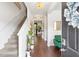 Bright and airy foyer with hardwood floors and a staircase at 7977 Rudder Cir, Fairburn, GA 30213