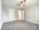 Bedroom with grey carpet and double door closet at 9020 Amberly Way, Cumming, GA 30028