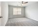 Bedroom with grey carpet and large window at 9020 Amberly Way, Cumming, GA 30028