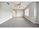 Spacious bedroom with grey carpet and ceiling fan at 9020 Amberly Way, Cumming, GA 30028