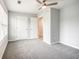 Bedroom with grey carpet and double door closet at 9020 Amberly Way, Cumming, GA 30028