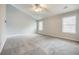 Large bedroom featuring gray carpet and vaulted ceilings at 9020 Amberly Way, Cumming, GA 30028