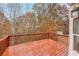 Wooden deck overlooking a wooded backyard at 9020 Amberly Way, Cumming, GA 30028