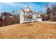 Two-story house with brick and siding, a porch, and a two-car garage at 9020 Amberly Way, Cumming, GA 30028