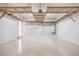 Garage with built-in shelving and light gray walls at 9020 Amberly Way, Cumming, GA 30028