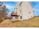 Two-story house with deck, patio, and fire pit area at 9020 Amberly Way, Cumming, GA 30028