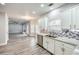 Open concept kitchen with views into the living room and breakfast area at 9020 Amberly Way, Cumming, GA 30028