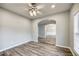 Light-filled office with hardwood floors and an arched opening at 9020 Amberly Way, Cumming, GA 30028