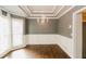 Formal dining room with hardwood floors and wainscoting at 9921 Between The Grns, Villa Rica, GA 30180