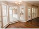 Dining area with hardwood floors and large windows at 9921 Between The Grns, Villa Rica, GA 30180