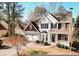 Two-story house with stone accents and a landscaped yard at 9921 Between The Grns, Villa Rica, GA 30180