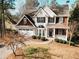 Two-story house with stone accents and a landscaped yard at 9921 Between The Grns, Villa Rica, GA 30180