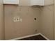 Laundry room with built-in shelving and hookups at 9921 Between The Grns, Villa Rica, GA 30180