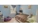 Cozy bedroom with light blue walls and double bed at 121 Millwheel Dr, Villa Rica, GA 30180