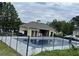 Community in-ground pool with a pool house and fenced area at 121 Millwheel Dr, Villa Rica, GA 30180