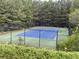 Outdoor tennis court with blue surface at 121 Millwheel Dr, Villa Rica, GA 30180