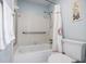 Clean bathroom with a shower/tub, grab bars, and updated fixtures at 1801 Parkaire Xing, Marietta, GA 30068