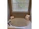 Relaxing bathroom with soaking tub and neutral colors at 2770 Stony Place Ct, Grayson, GA 30017