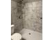 Updated bathroom with a large shower and marble tile at 2770 Stony Place Ct, Grayson, GA 30017