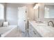 Bathroom with double vanity, marble countertops, and tiled floors at 2770 Stony Place Ct, Grayson, GA 30017