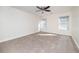 Bright bedroom with neutral carpeting and ceiling fan at 2770 Stony Place Ct, Grayson, GA 30017