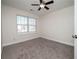 Bright bedroom featuring neutral walls and plush carpeting at 2770 Stony Place Ct, Grayson, GA 30017