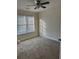 Bright bedroom with neutral carpeting and ceiling fan at 2770 Stony Place Ct, Grayson, GA 30017