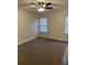 Spacious bedroom with neutral carpeting and ceiling fan at 2770 Stony Place Ct, Grayson, GA 30017