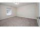 Well-lit bedroom with neutral walls and carpet flooring at 2770 Stony Place Ct, Grayson, GA 30017