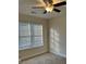 Well-lit bedroom featuring neutral walls and carpeting at 2770 Stony Place Ct, Grayson, GA 30017