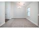 Spacious dining room with large window and carpet at 2770 Stony Place Ct, Grayson, GA 30017