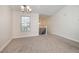 Spacious dining room with neutral carpeting and a view to the upper level at 2770 Stony Place Ct, Grayson, GA 30017